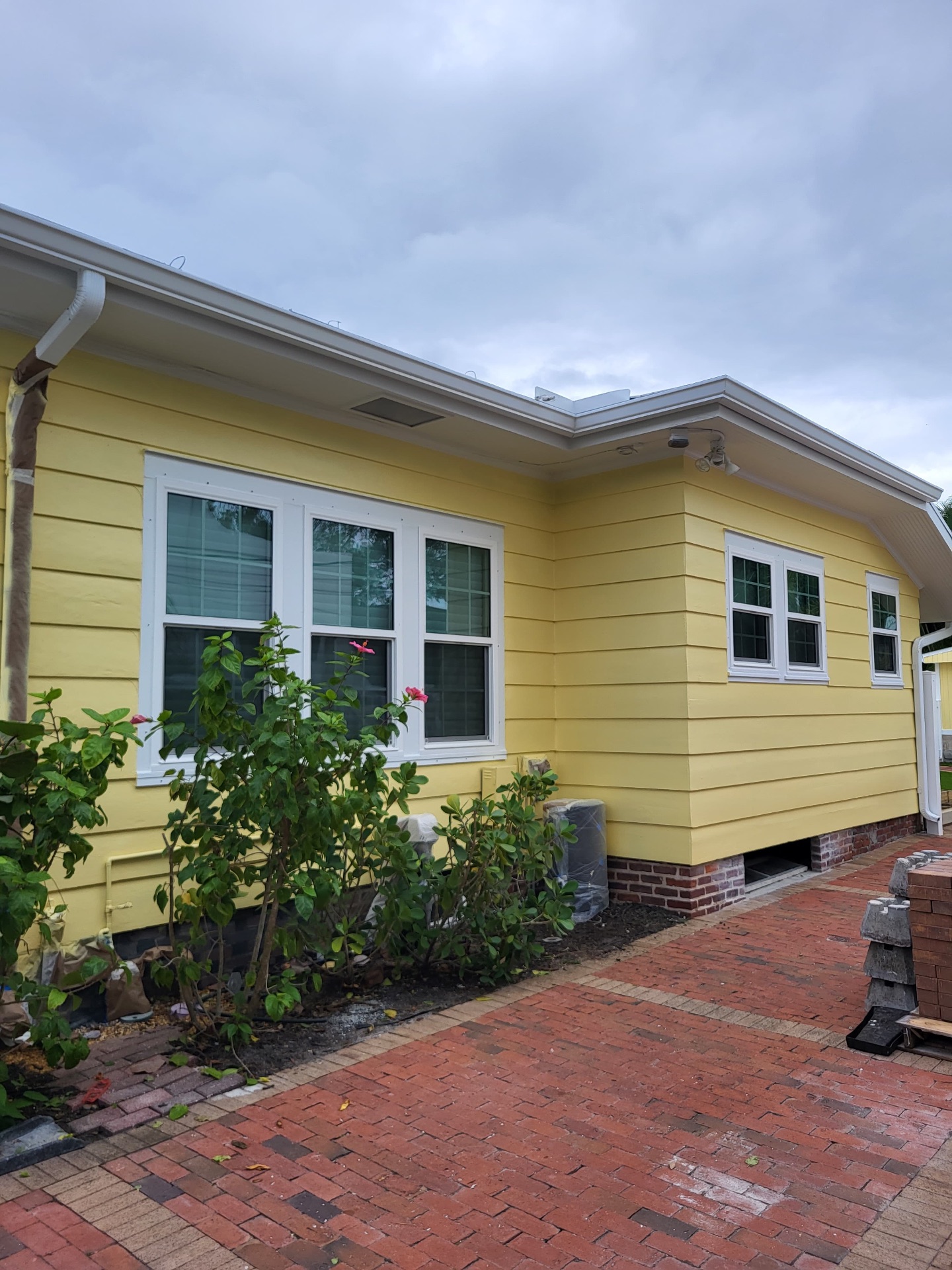 Freshly painted yellow Florida home exterior