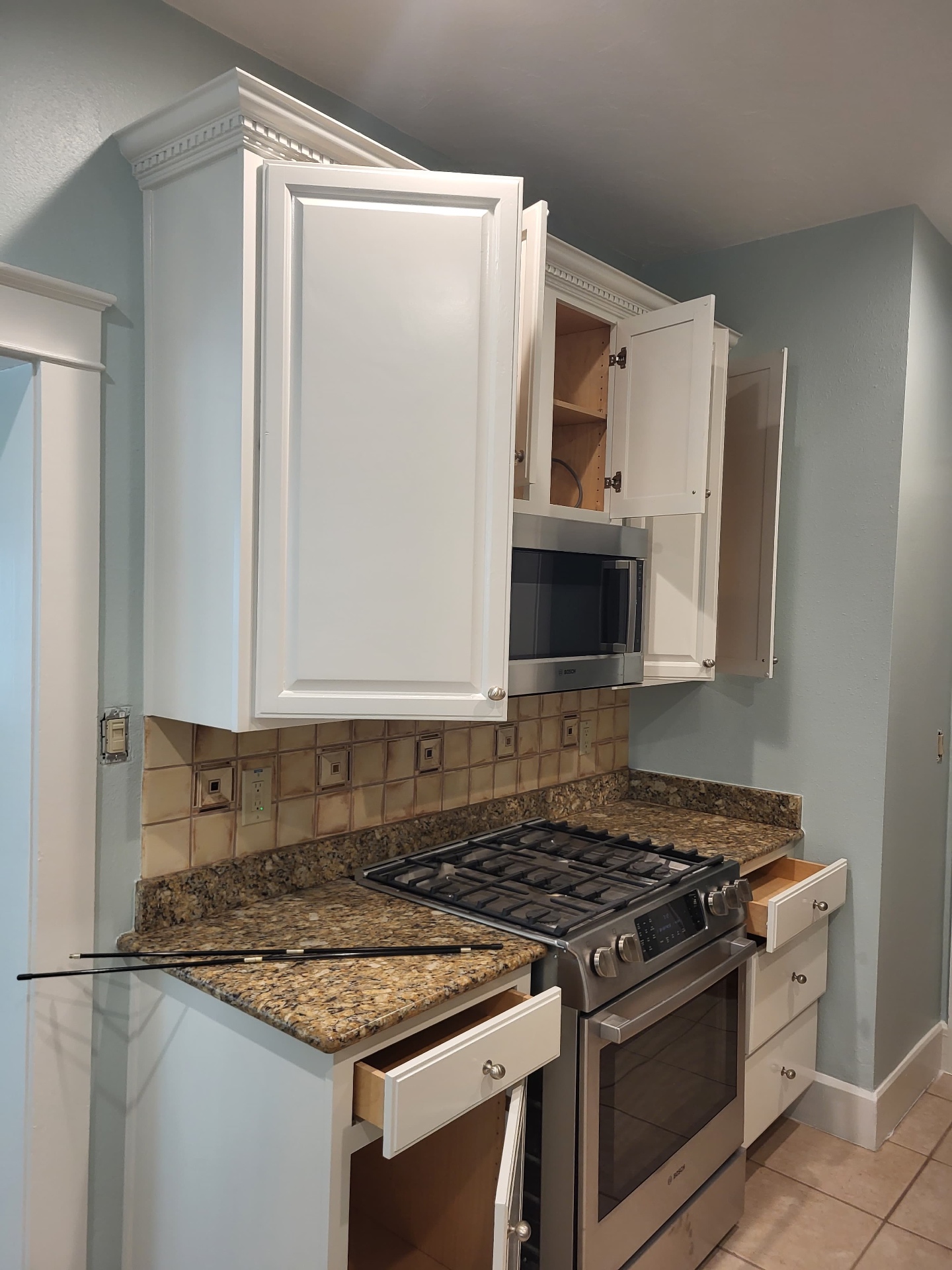 Crisp white repainted kitchen cabinets